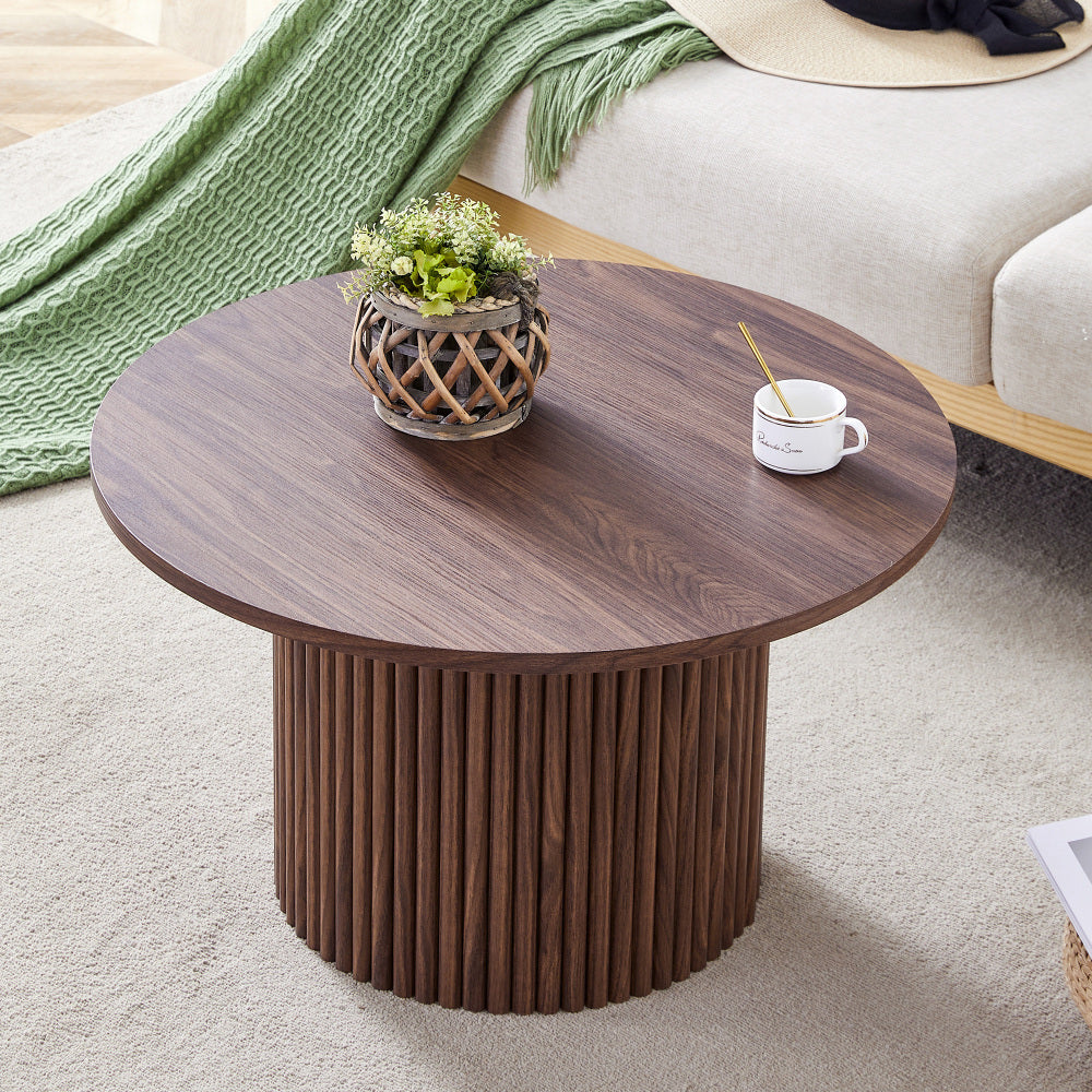 A modern circular coffee table with a diameter of 27.5 inches interprets home aesthetics and practicality. MDF material,cylindrical table leg design.Becoming the visual focal point of home decoration.